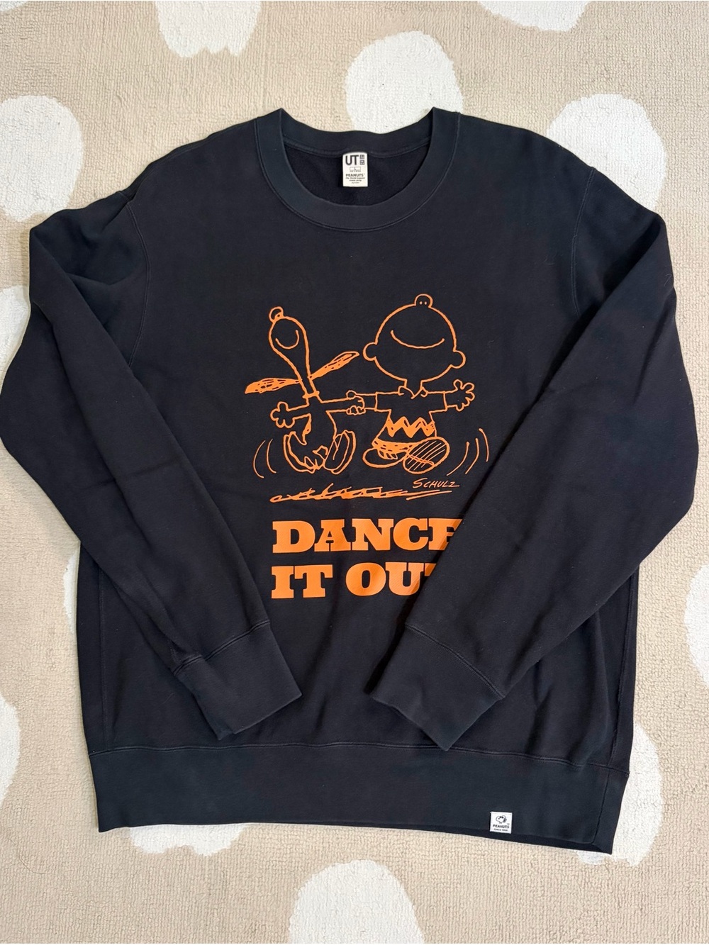 Uniqlo Black Crewneck Sweatshirt with Orange Peanuts 'Dance It Out' Graphic